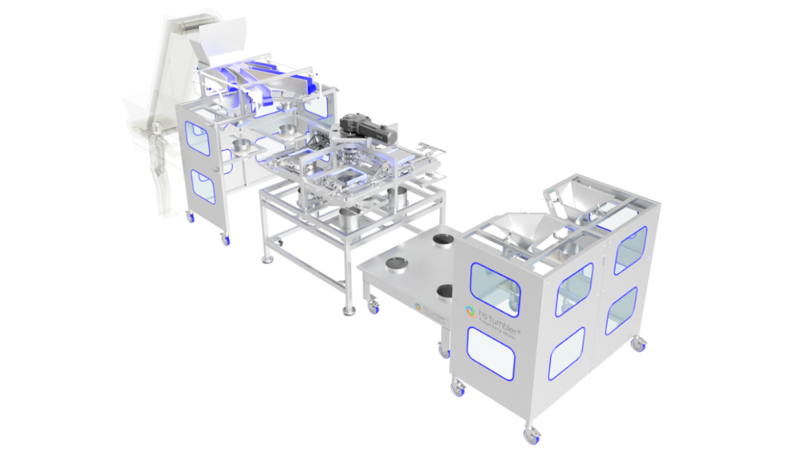 An industrial machine called "hs Tumbler," constructed mainly from metal with multiple movable parts, chutes, and filling hoppers. The sturdy stainless steel frame is mounted on wheels and features large side windows for viewing the interior. The surfaces are designed for hygiene and easy cleaning. The device is intended for automated mixing or scattering procedures in industrial or scientific settings.