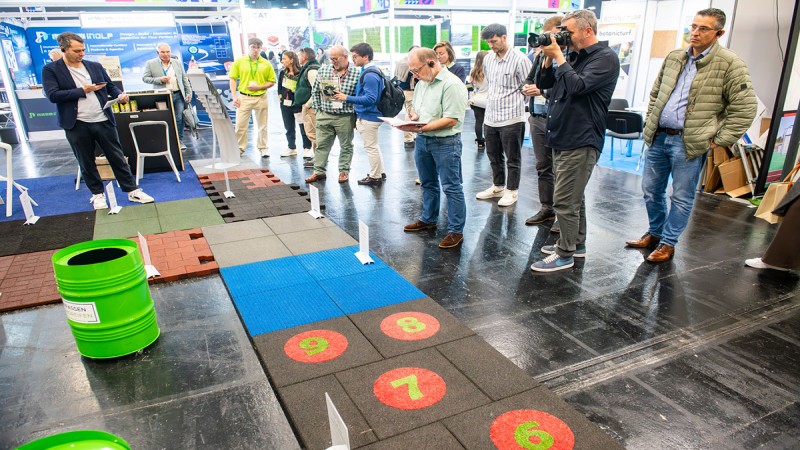 NEW LIFE stand with group of people and various floor coverings