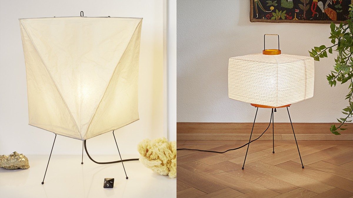 Two modern table lamps with paper or fabric shades and thin metal frames, placed side by side.