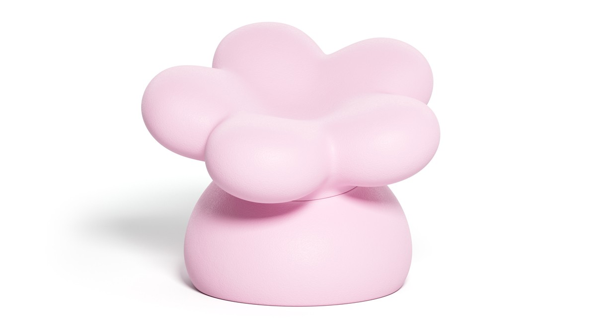 Pink flower-shaped designer armchair on a light background.