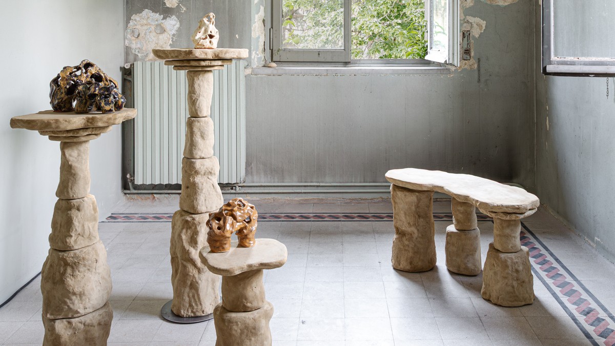 Jules Péan’s “New Rocks” furniture series with organic stone-like forms in a historic interior.