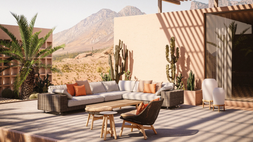 Terrasse mit einem Rattan-Sofa, einem Tisch und Sessel. Terrasse mit einem Rattan-Sofa, einem Tisch und Sessel.