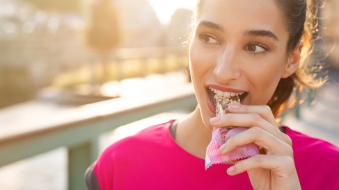 Woman eating energy bar_1200x675