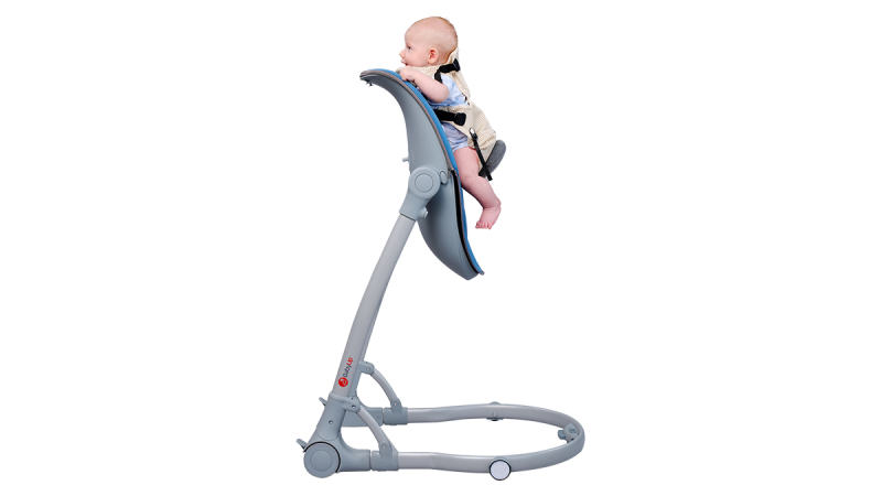 Baby sitting in a gray modern high chair with safety harness and adjustable backrest
