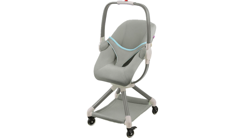 Gray baby high chair with safety harness, wheels, and storage shelf underneath