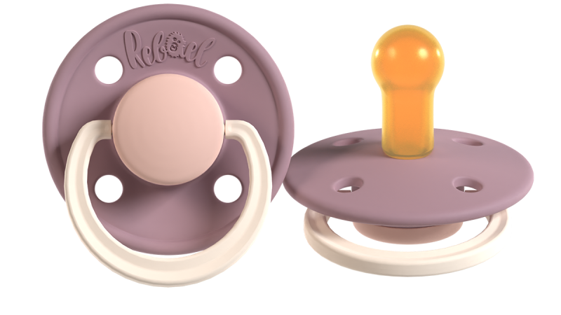 Two Rebael brand baby pacifiers with mauve shields, one showing the front with a beige handle, the other showing the amber nipple