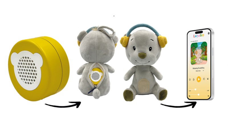 Yellow circular speaker with bear face design, gray bear plush toy with speaker on back, and smartphone showing Lenabo app playing audio