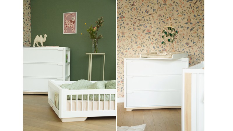 Two views of a nursery with white wooden furniture including a crib and dresser, green and floral wallpaper, a small table with flowers, and a camel figurine on the dresser