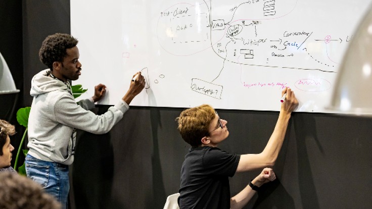 Participants in the hackathon at PMRExpo 2025