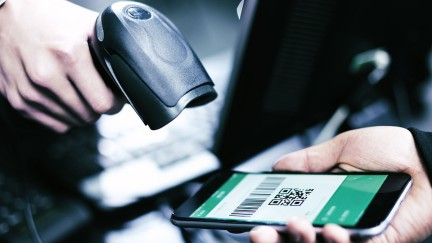 A digital ticket is being scanned on a smartphone